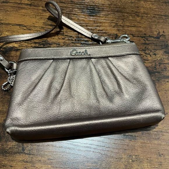 Coach Handbags - Coach metallic copper wristlet EUC